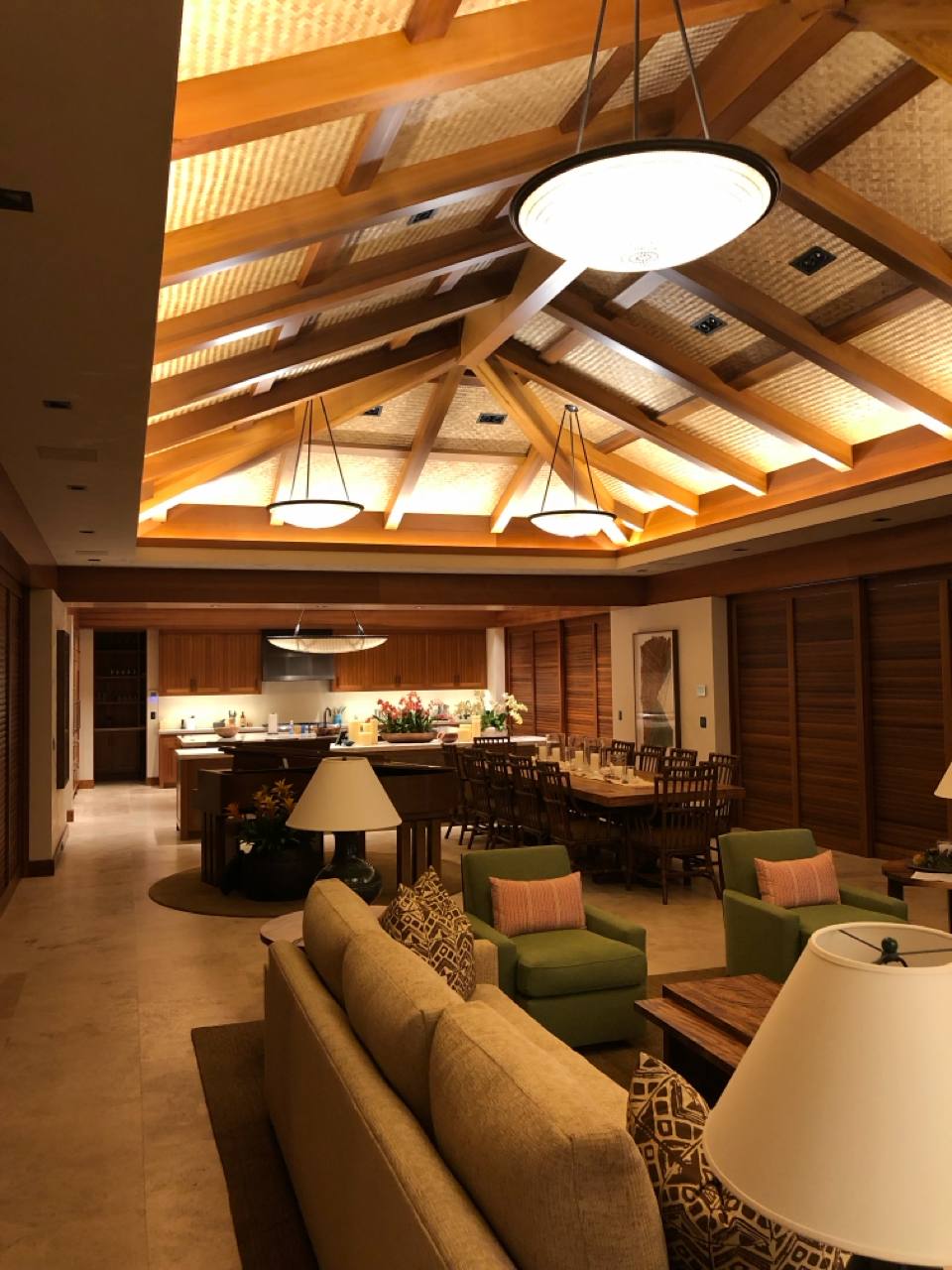Kukio great room — vaulted koa beams, lauhala ceiling, Lutron lighting scenes by SmartHomes.us