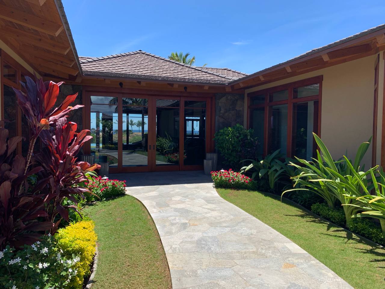 Kukio estate — open-air tropical pavilion with lava rock walls
