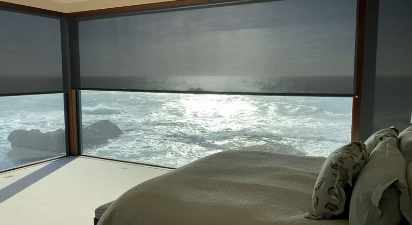 Automated Lutron shades — motorized window treatments in luxury residence