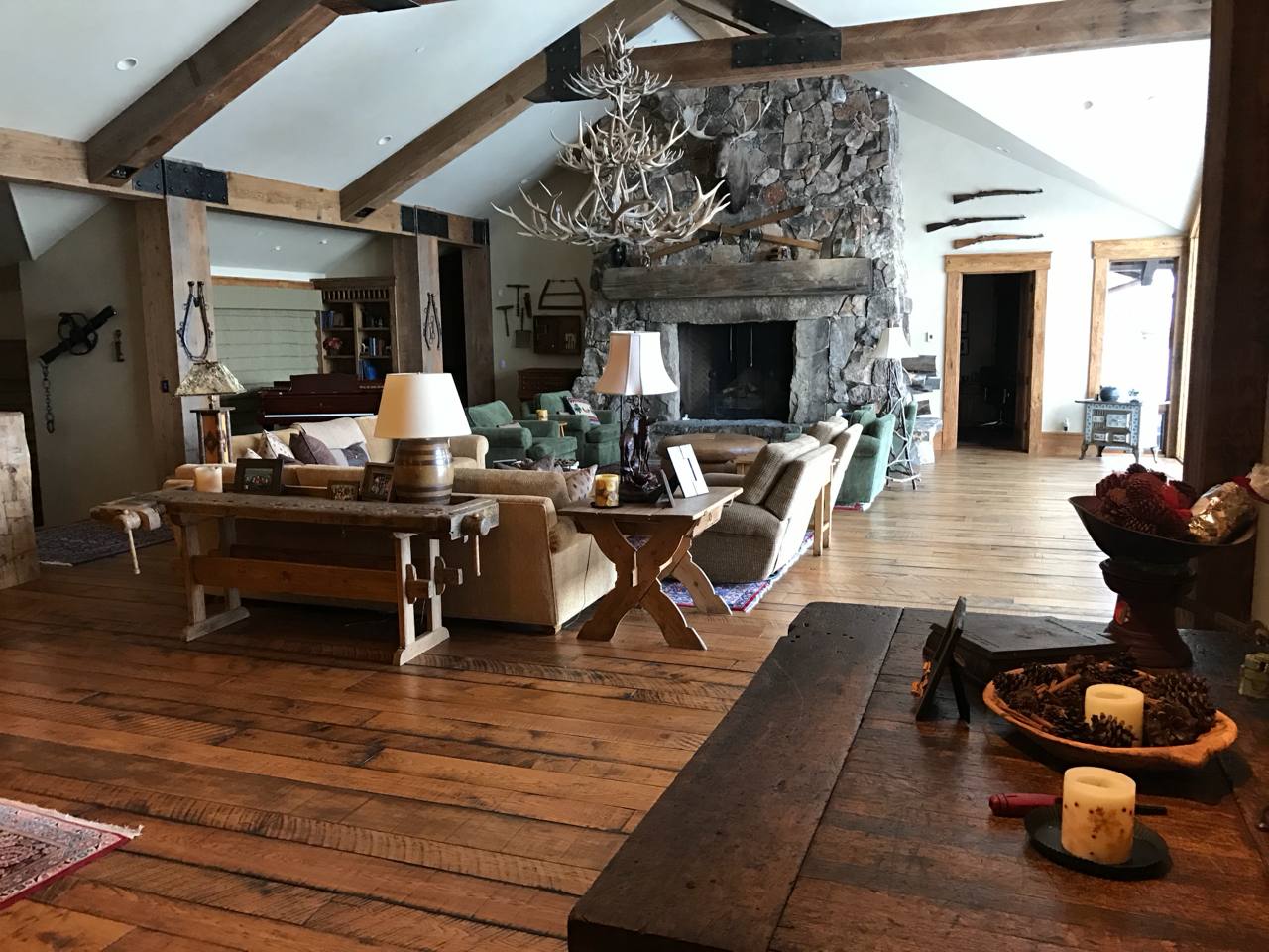 Park City Utah — stone fireplace, antler chandelier, vaulted beams, rustic lodge living room
