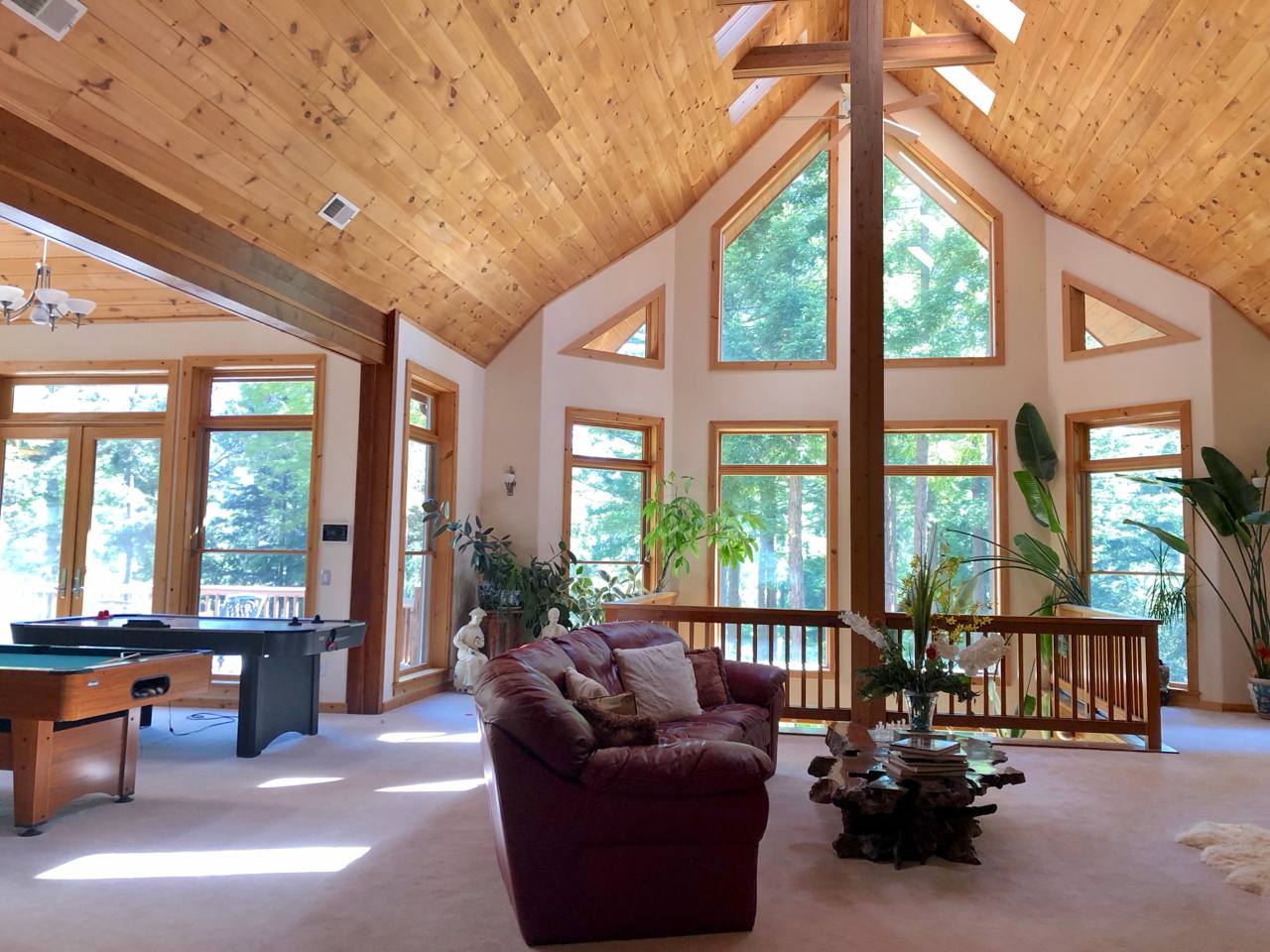 Truckee CA — Martis Camp, cathedral pine ceiling, A-frame windows into forest, game room